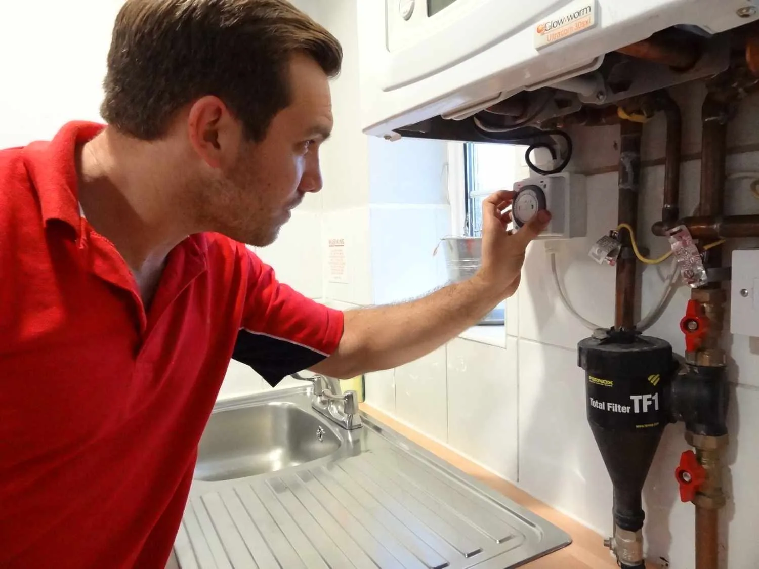 Battersea Plumbers 247 boiler repair engineer working on a boiler in Battersea